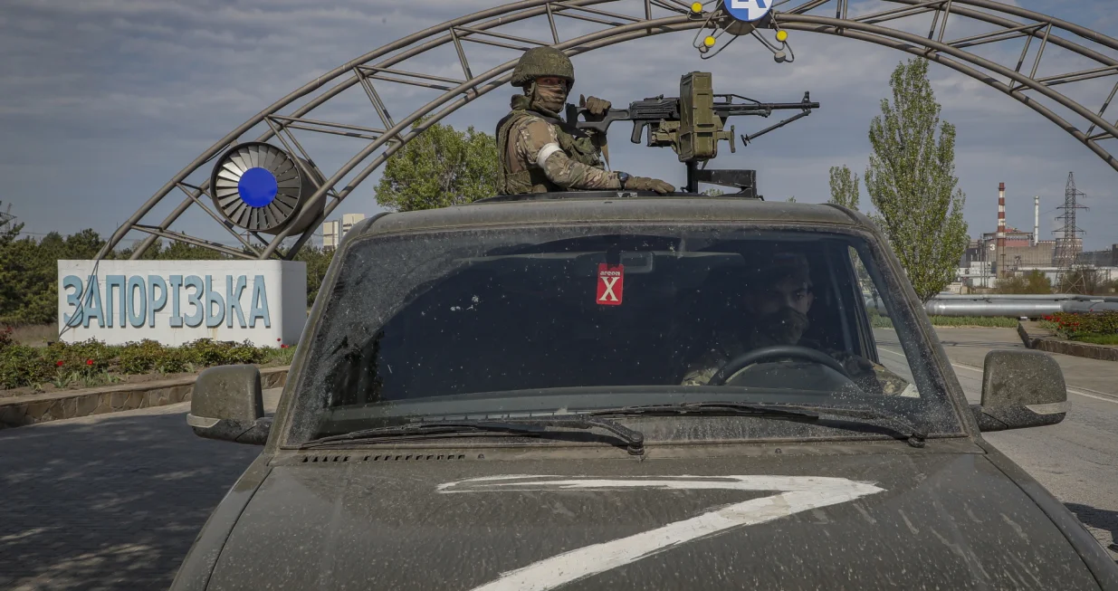 epa10106038 (FILE) A picture taken during a visit to Mariupol organized by the Russian military shows Russian servicemen on guard at the Zaporizhzhia Nuclear Power Station in Enerhodar, southeastern Ukraine, 01 May 2022 (reissued 04 August 2022). Europe's biggest nuclear plant Zaporizhzhia situated near the frontline, needs an inspection and repairs, IAEA Director General Rafael Mariano Grossi said on 01 August 2022. On 24 February Russian troops entered Ukrainian territory in what the Russian president declared a 'special military operation', resulting in fighting and destruction in the country, a huge flow of refugees, and multiple sanctions against Russia. EPA/SERGEI ILNITSKY/Sergei Ilnitsky