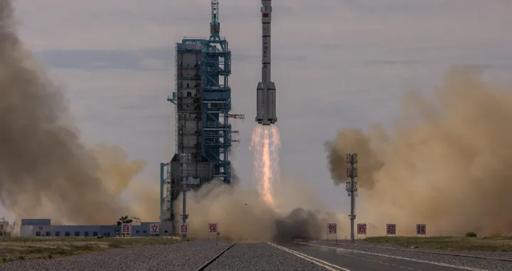 epa09278524 The Long March-2F carrier rocket, carrying the Shenzhou-12, takes off from the launch site at the Jiuquan Satellite Launch Center, in the Gobi Desert, Inner Mongolia, near Jiuquan, China, 17 June 2021. China launched the Shenzhou-12 spacecraft carrying three crew members Tang Hongbo, Nie Haisheng, and Liu Boming to the orbiting Tianhe core module for a three-month mission on 17 June. The mission is China's first manned spaceflight in almost five years. EPA/ROMAN PILIPEY/Roman Pilipey