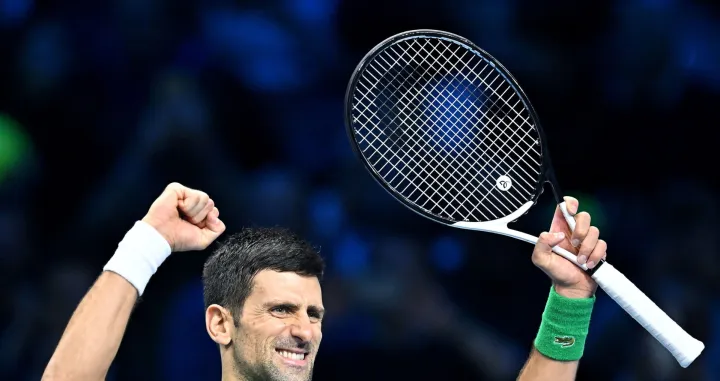 epa10314759 Novak Djokovic of Serbia celebrates after defeating Taylor Fritz of the USA in their semi final match of the Nitto ATP Finals 2022 tennis tournament at the Pala Alpitour arena in Turin, Italy, 19 November 2022. EPA/Alessandro Di Marco