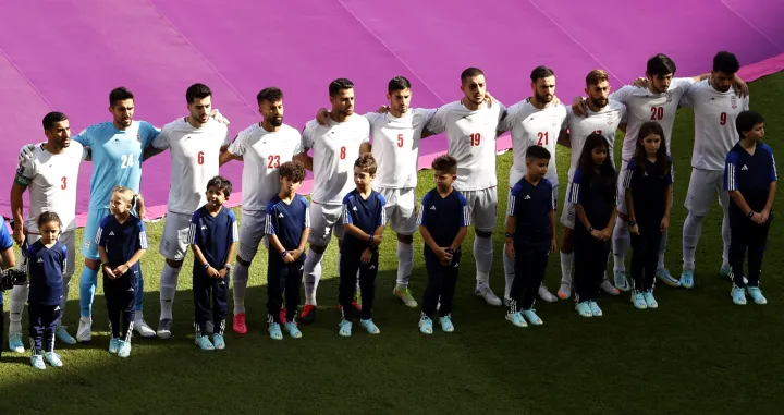 epa10327041 The team of Iran during the national anthem before the FIFA World Cup 2022 group B soccer match between Wales and Iran at Ahmad bin Ali Stadium in Doha, Qatar, 25 November 2022. EPA/Rungroj Yongrit