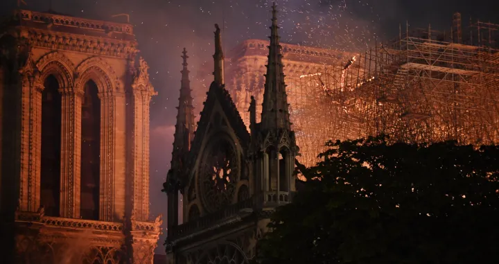 epa08345201 (FILE) The flames burning the roof of the Notre-Dame Cathedral in Paris, France, 15 April 2019 (reissued 06 April 2020). A year ago, on 15 April 2019, the 850-year-old Notre-Dame Cathedral of Paris suffered a devastating fire. Some 500 firefighters managed to prevent the entire cathedral from being reduced to ashes, although its celebrated spire has been destroyed. French President Emmanuel Macron promised to rebuild the cathedral within five years. EPA/JULIEN DE ROSA ATTENTION: This Image is part of a PHOTO SET *** Local Caption *** 55128799/Julien De Rosa