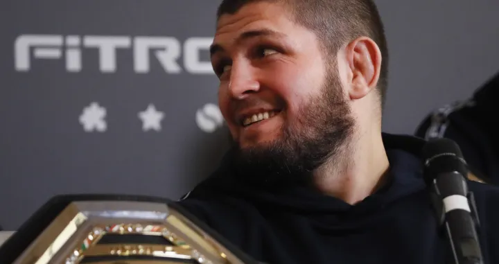 epa09640132 Former Russian mixed martial arts (MMA) fighter, UFC lightweight titleholder Khabib Nurmagomedov attends a press conference in Moscow, Russia, 13 December 2021. Nurmagomedov spoke about cooperation with the Fitroo brand and his team's plans for the coming year. EPA/YURI KOCHETKOV