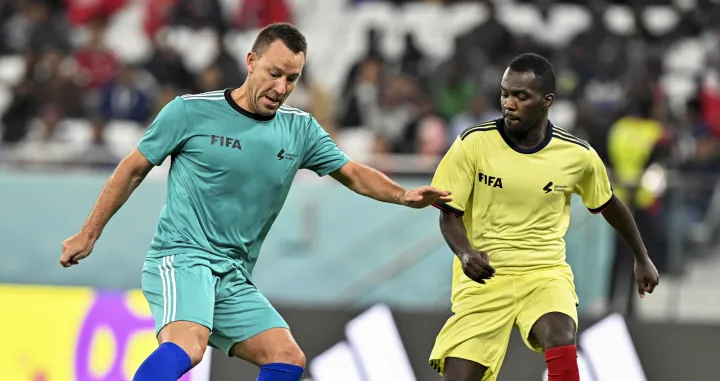 epa10362451 Former English player John Terry (L) in action during the Workers and FIFA Legends soccer match at Al Thumama Stadium in Doha, Qatar, 12 December 2022. FIFA World Cup 2022 guests and volunteers watched workers and FIFA legends playing in a 60-minute match. EPA/NOUSHAD THEKKAYIL