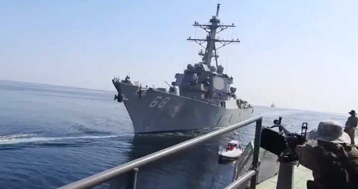 epa09561872 A handout video grab taken from a video made available by the Iranian Revolutionary Guard Corps (IRGC) on 03 November 2021 shows, Iranian soldier on a jet boat in front of a US warship during the seizure of a Vietnam-flagged oil tanker in the Gulf of Oman. According to IRGC official website Sepahnews, Iran seized the tanker in the Gulf of Oman on 25 October 2021 which caused some hours tension between Iran and US forces. The tension between Iran and US is going on over Irans nuclear programm. EPA/SEPAHNEWS HANDOUT HANDOUT EDITORIAL USE ONLY/NO SALES/Sepahnews Handout