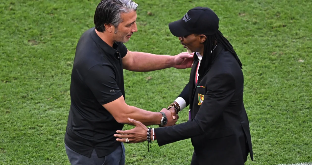 epa10324658 Head coach Rigobert Song of Cameroon (R) reacts with Head coach Murat Yakin of Switzerland after the FIFA World Cup 2022 group G soccer match between Switzerland and Cameroon at Al Janoub Stadium in Al Wakrah, Qatar, 24 November 2022. EPA/Noushad Thekkayil
