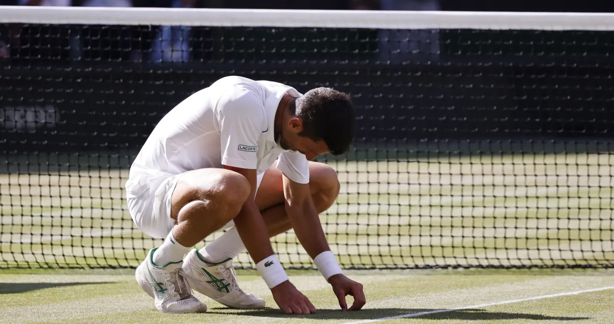 epa10064114 Novak Djokovic of Serbia after winning the men's final match against Nick Kyrgios of Australia at the Wimbledon Championships, in Wimbledon, Britain, 10 July 2022. EPA/TOLGA AKMEN EDITORIAL USE ONLY