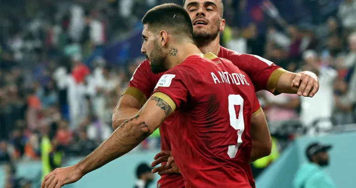 epa10345052 Aleksandar Mitrovic of Serbia celebrates scoring the 1-1 with Filip Kostic (back) during the FIFA World Cup 2022 group G soccer match between Serbia and Switzerland at Stadium 947 in Doha, Qatar, 02 December 2022. EPA/Georgi Licovski