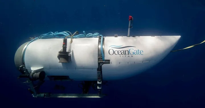 FILE PHOTO: The Titan submersible, operated by OceanGate Expeditions to explore the wreckage of the sunken SS Titanic off the coast of Newfoundland, dives in an undated photograph. OceanGate Expeditions/Handout via REUTERS NO RESALES. NO ARCHIVES. THIS IMAGE HAS BEEN SUPPLIED BY A THIRD PARTY./File Photo/Oceangate Expeditions