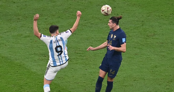 epa10372234 Julian Alvarez (L) of Argentina in action against Adrien Rabiot of France during the FIFA World Cup 2022 Final between Argentina and France at Lusail stadium, Lusail, Qatar, 18 December 2022. EPA/Georgi Licovski