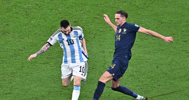epa10372592 Lionel Messi of Argentina in action against Adrien Rabiot of France (R) during the FIFA World Cup 2022 Final between Argentina and France at Lusail stadium, Lusail, Qatar, 18 December 2022. EPA/Noushad Thekkayil