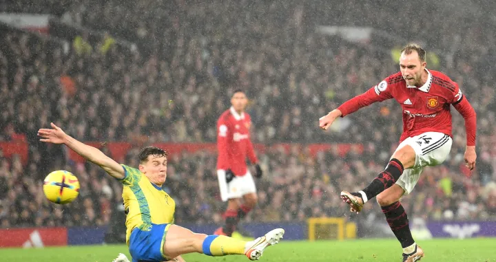 epa10379473 Christian Eriksen (R) of Manchester United takes a shot on goal during the English Premier League soccer match between Manchester United and Nottingham Forest in Manchester, Britain, 27 December 2022. EPA/Peter Powell EDITORIAL USE ONLY. No use with unauthorized audio, video, data, fixture lists, club/league logos or 'live' services. Online in-match use limited to 120 images, no video emulation. No use in betting, games or single club/league/player publications