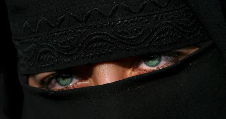 epa08442524 Only the eyes are seen through the black veil covering the face of a female activist during a sit-in protest in central Srinagar, the summer capital of Indian Kashmir, 27 October 2007 (reissued 25 May 2020). Black is synonymous with darkness and represents the total opposite of white. It is commonly used to symbolize danger, evil, death and mourning, but is also connected to positive notions like strength, elegance and sophistication. EPA/ALTAF QADRI ATTENTION: This Image is part of a PHOTO SET *** Local Caption *** 50330789/Altaf Qadri