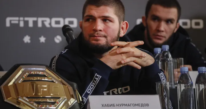 epa09640129 Former Russian mixed martial arts (MMA) fighter, UFC lightweight titleholder Khabib Nurmagomedov attends a press conference in Moscow, Russia, 13 December 2021. Nurmagomedov spoke about cooperation with the Fitroo brand and his team's plans for the coming year. EPA/YURI KOCHETKOV