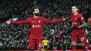 epa10394854 Mohamed Salah of Liverpool (L) celebrates with Darwin Nunez of Liverpool (R) after scoring the 2-1 goal during the 3rd round FA Cup soccer match between Liverpool and Wolverhampton Wanderers at Anfield in Liverpool, Britain, 07 January 2023. EPA/ADAM VAUGHAN