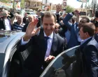 epa09623541 Syrian President Bashar al-Assad waves at supporters as he leaves a polling station in Duma city, Syria, 26 May 2021. The city was liberated by the Syrian army in 2018 after driving rebels out. Syrians will choose one out of three candidates, including Assad, for the post of President of the Syrian Arab Republic. The number of eligible voters registered inside and outside Syria has reached more than 18 million. EPA/YOUSSEF BADAWI/Youssef Badawi