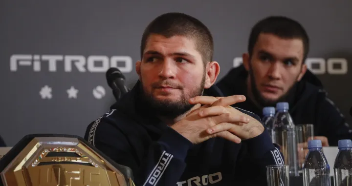 epa09640129 Former Russian mixed martial arts (MMA) fighter, UFC lightweight titleholder Khabib Nurmagomedov attends a press conference in Moscow, Russia, 13 December 2021. Nurmagomedov spoke about cooperation with the Fitroo brand and his team's plans for the coming year. EPA/YURI KOCHETKOV