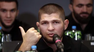 epa09418937 Former Russian mixed martial arts (MMA) fighter, UFC lightweight titleholder Khabib Nurmagomedov attends a press conference in Moscow, Russia, 18 August 2021. Khabib Nurmagomedov said that he became a shareholder of the UFC. EPA/MAXIM SHIPENKOV