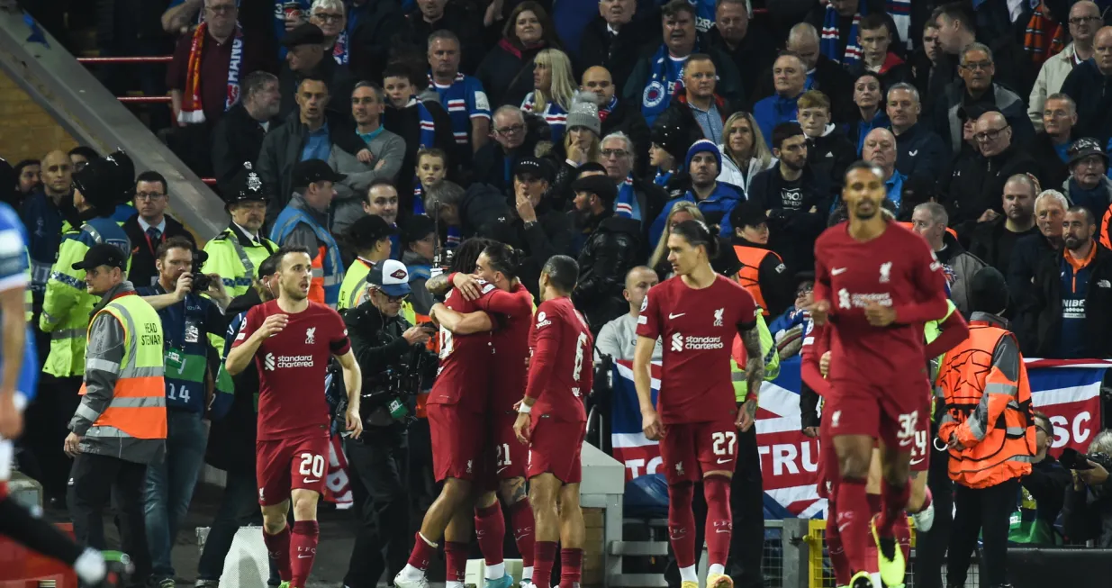 epa10223578 Trent Alexander-Arnold of Liverpool FC celebrates with team mates after scoring a goal during the UEFA Champions League group A soccer match between Liverpool FC and Rangers FC in Liverpool, Britain, 04 October 2022. EPA/Peter Powell