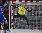 epa09838714 France' Ludovic Fabregas (L) in action against Denmark's goalkeeper Emil Nielsen during the Golden League men's handball match between Denmark and France, in Aarhus, Denmark, 20 March 2022. EPA/Mikkel Berg Pedersen DENMARK OUT