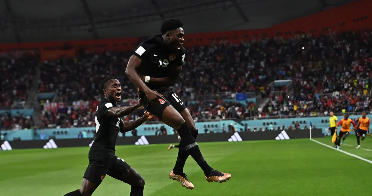 epa10332776 Alphonso Davies of Canada celebrates scoring the 0-1 goal during the FIFA World Cup 2022 group F soccer match between Croatia and Canada at Khalifa International Stadium in Doha, Qatar, 27 November 2022. EPA/Noushad Thekkayil