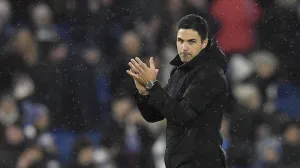 epa10384349 Mikel Arteta manager of Arsenal applauds the fans after the English Premier League soccer match between Brighton & Hove Albion FC and Arsenal London in Brighton, Britain, 31 December 2022. EPA/Vince Mignott EDITORIAL USE ONLY. No use with unauthorized audio, video, data, fixture lists, club/league logos or 'live' services. Online in-match use limited to 120 images, no video emulation. No use in betting, games or single club/league/player publications