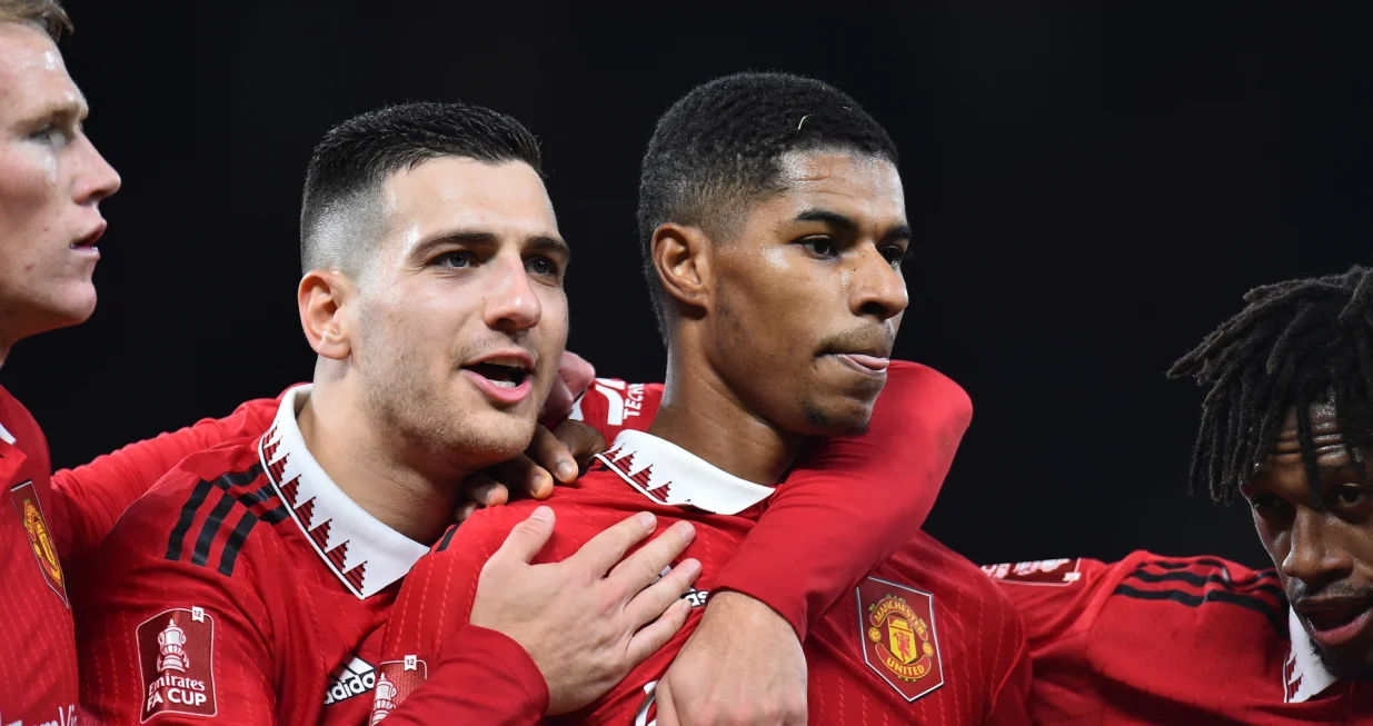 epa10393233 Manchester United's Marcus Rashford (C-R), assisted by teammates, reacts after scoring for 3-1 against Everton during the FA Cup third round match between Manchester United and Everton in Manchester, Britain, 06 January 2023. EPA/Peter Powell EDITORIAL USE ONLY. No use with unauthorized audio, video, data, fixture lists, club/league logos or 'live' services. Online in-match use limited to 120 images, no video emulation. No use in betting, games or single club/league/player publications