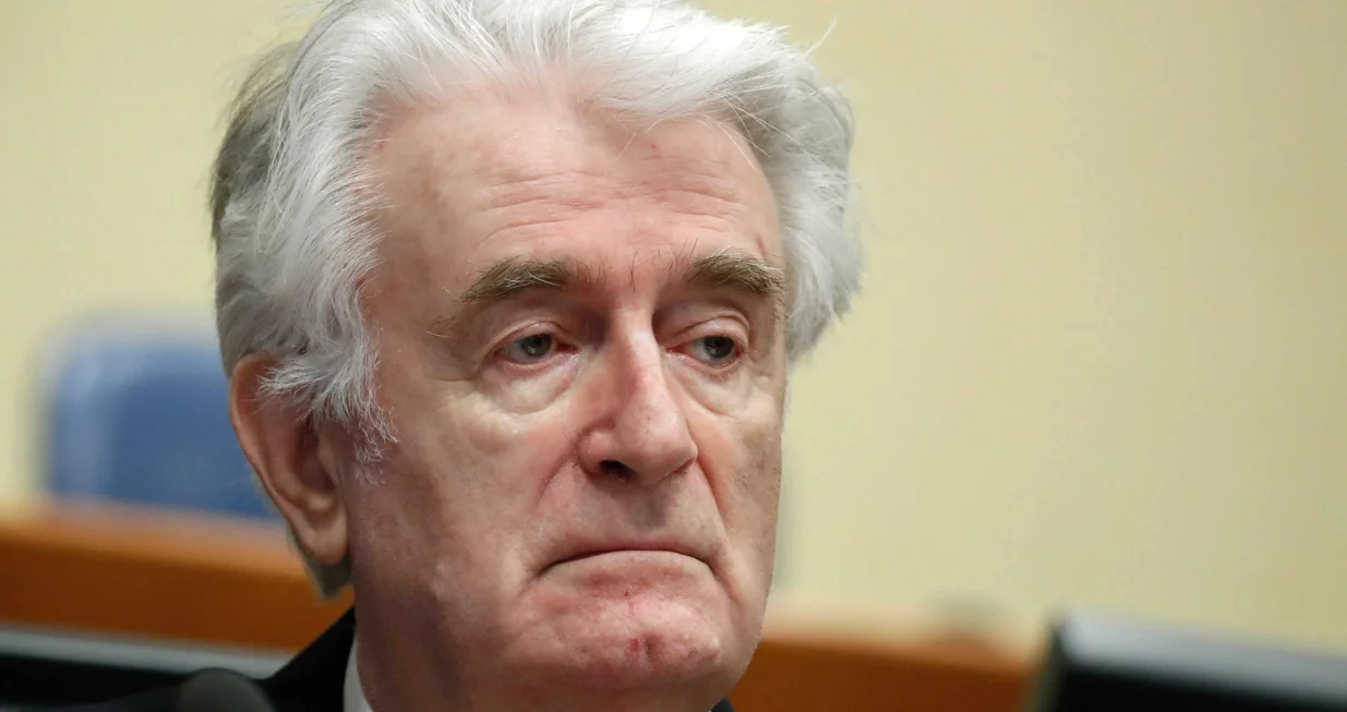 epa08529984 (FILE) - Former Bosnian Serb leader Radovan Karadzic appears in a courtroom before the International Residual Mechanism for Criminal Tribunals (MICT), which handles outstanding war crimes cases for the Balkans and Rwanda, in The Hague, The Netherlands, 24 April 2018 (reissued 06 July 2020). A quarter of a century ago, the world witnessed the worst mass murder on European soil since World War II. Some 7,000-8,000 Bosniaks were slaughtered and 20,000 civilians were forcibly displaced in an act of ethnic cleansing perpetrated in the small eastern Bosnian village of Srebrenica, whose name will forever be linked to the infamous 1995 massacre. Today, 25 years after the massacre, the memory of its victims is kept alive by several institutions, such as the Museum of Crimes Against Humanity and Genocide in Sarajevo or a permanent exhibit at the 'Memorial Center Srebrenica-Potocari' that now occupies the former headquarters of the Dutch UNPROFOR Battalion. EPA/YVES HERMAN/POOL ATTENTION: This Image is part of a PHOTO SET/Yves Herman/Pool