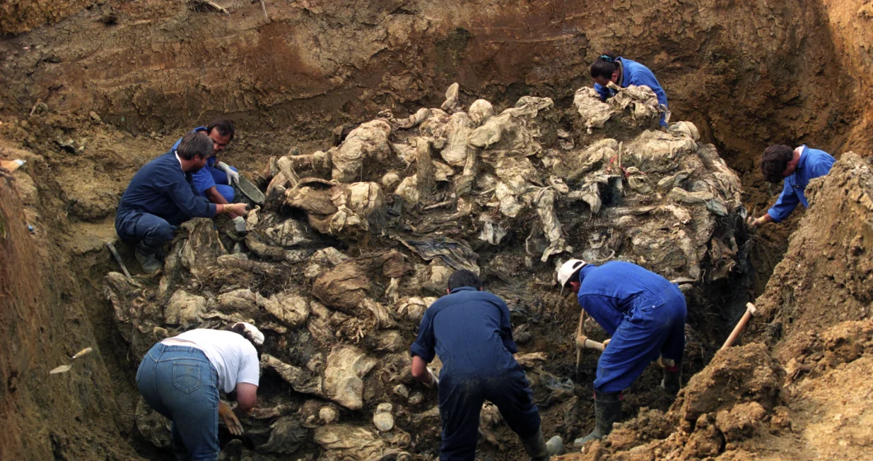 epa08529965 (FILE) - Investigators of the International War Crimes Tribunal work at the mass grave where they discovered the remains of more than 100 executed people outside the village of Pilica, Bosnia and Herzegovina, 18 September 1996 (reissued 06 July 2020). A quarter of a century ago, the world witnessed the worst mass murder on European soil since World War II. Some 7,000-8,000 Bosniaks were slaughtered and 20,000 civilians were forcibly displaced in an act of ethnic cleansing perpetrated in the small eastern Bosnian village of Srebrenica, whose name will forever be linked to the infamous 1995 massacre. Today, 25 years after the massacre, the memory of its victims is kept alive by several institutions, such as the Museum of Crimes Against Humanity and Genocide in Sarajevo or a permanent exhibit at the 'Memorial Center Srebrenica-Potocari' that now occupies the former headquarters of the Dutch UNPROFOR Battalion. EPA/ODD ANDERSEN ATTENTION: This Image is part of a PHOTO SET/Odd Andersen