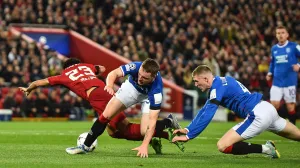 epa10223773 Luis Diaz of Liverpool FC (L) in action against Leon King of Rangers FC (R) during the UEFA Champions League group A soccer match between Liverpool FC and Rangers FC in Liverpool, Britain, 04 October 2022. EPA/Peter Powell