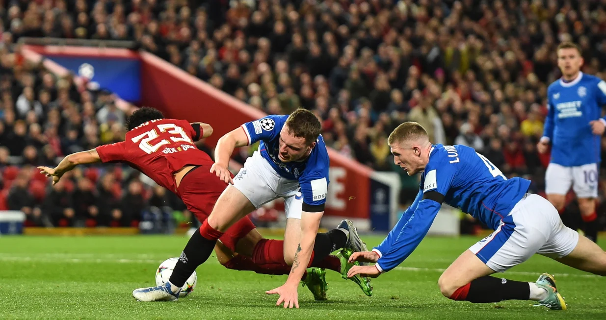 epa10223773 Luis Diaz of Liverpool FC (L) in action against Leon King of Rangers FC (R) during the UEFA Champions League group A soccer match between Liverpool FC and Rangers FC in Liverpool, Britain, 04 October 2022. EPA/Peter Powell