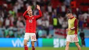 epa10337513 Welsh players Aaron Ramsey (L) and Gareth Bale (R) react after the FIFA World Cup 2022 group B soccer match between Wales and England at Ahmad bin Ali Stadium in Doha, Qatar, 29 November 2022. EPA/Friedemann Vogel