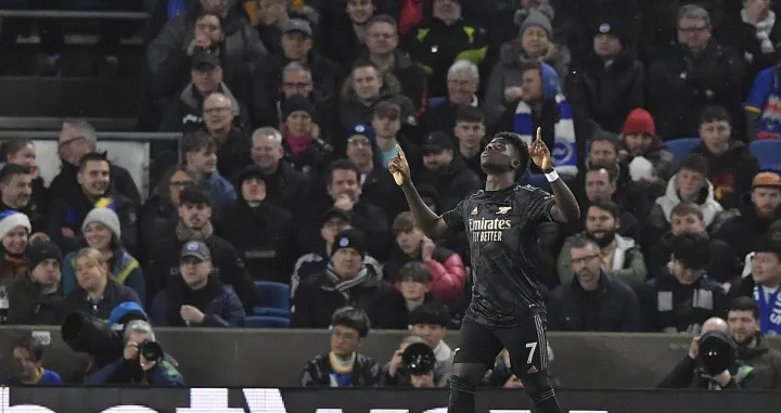 epa10384186 Bukayo Saka of Arsenal celebrates scoring the opening goal during the English Premier League soccer match between Brighton & Hove Albion FC and Arsenal London in Brighton, Britain, 31 December 2022. EPA/Vince Mignott EDITORIAL USE ONLY. No use with unauthorized audio, video, data, fixture lists, club/league logos or 'live' services. Online in-match use limited to 120 images, no video emulation. No use in betting, games or single club/league/player publications