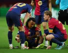 Soccer Football - Champions League - Semi Final - First Leg - FC Barcelona v Inter Milan - Estadi Olimpic Lluis Companys, Barcelona, Spain - April 30, 2025 FC Barcelona's Jules Kounde reacts after sustaining an injury REUTERS/Albert Gea