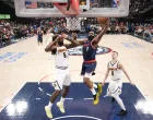 May 1, 2025; Inglewood, California, USA; LA Clippers guard James Harden (1) shoots the ball against Denver Nuggets center DeAndre Jordan (6) and guard Christian Braun (0) in the first half during game six of first round for the 2025 NBA Playoffs at Intuit Dome. Mandatory Credit: Kirby Lee-Imagn Images