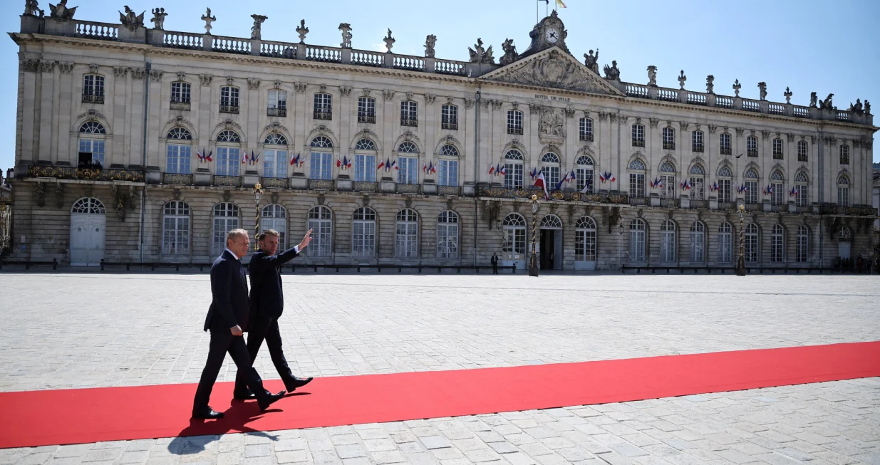 French President Emmanuel Macron welcomes Polish Prime Minister Donald Tusk on Stanislas square in Nancy, France, May 9, 2025. Macron and Tusk meet in Nancy as part of a summit to sign a treaty of friendship and enhanced cooperation between France and Poland. Christophe Petit Tesson/Pool via REUTERS TPX IMAGES OF THE DAY/Christophe Petit Tesson