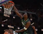 May 10, 2025; San Francisco, California, USA; Minnesota Timberwolves guard Anthony Edwards (5) dunks over Golden State Warriors forward Kevon Looney (5) in the third quarter during game three in the second round for the 2025 NBA Playoffs at Chase Center. Mandatory Credit: David Gonzales-Imagn Images