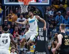 May 11, 2025; Indianapolis, Indiana, USA; Indiana Pacers forward Obi Toppin (1) shoots the ball while Cleveland Cavaliers guard Donovan Mitchell (45) defends during game four of the second round for the 2025 NBA Playoffs at Gainbridge Fieldhouse. Mandatory Credit: Trevor Ruszkowski-Imagn Images