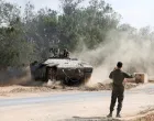 An Israeli armoured personnel carrier (APC) operates near the Israel-Gaza border, amid the ongoing conflict between Israel and Hamas, in Israel, May 19, 2025 REUTERS/Ronen Zvulun  TPX IMAGES OF THE DAY REFILE - CORRECTING TYPE OF VEHICLE FROM "AN ISRAELI TANK" TO "AN ISRAELI ARMOURED PERSONNEL CARRIER (APC)/Ronen Zvulun