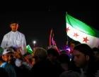 People celebrate after U.S. President Donald Trump said on Tuesday he would order the lifting of sanctions on Syria, in Damascus, Syria May 13, 2025. REUTERS/Yamam Al Shaar/Yamam Al Shaar