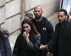 epa10397729 Former professional kickboxer and social media influencer, American-British businessman Andrew Tate (C), his brother Tristan (R), and unidentified women are escorted by Romanian police officers inside the Court of Appeal building for a hearing in their trial in Bucharest, Romania, 10 January 2023. On 29 December 2022, Andrew and Tristan Tate were arrested as a result of Directorate for Investigating Organized Crime and Terrorism (DIICOT) division inquiry under the charges of human trafficking and the intention of forming an organized crime group. Romanian police stated that the two brothers and their associates coerced victims for creating a paid pornography service for social media platforms. A Romanian judge ordered on 30 December 2022 that Andrew Tate shall remain in police custody for 30 days, as criminal police investigation is ongoing. In total, 11 cars and ten buildings located near Bucharest, or in Ilfov and Prahova counties, owned by the Tate brothers, were seized by the Romanian authorities until the inquiry will be finished. EPA/Robert Ghement/Robert Ghement