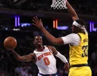 May 29, 2025; New York, New York, USA; New York Knicks guard Delon Wright (0) controls the ball against Indiana Pacers center Myles Turner (33) in the fourth quarter during game five of the eastern conference finals for the 2025 NBA Playoffs at Madison Square Garden. Mandatory Credit: Vincent Carchietta-Imagn Images