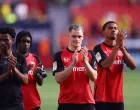 Soccer Football - Bundesliga - Bayer Leverkusen v Borussia Dortmund - BayArena, Leverkusen, Germany - May 11, 2025 Bayer Leverkusen's Florian Wirtz and Jeremie Frimpong applaud fans with teammates after the match REUTERS/Thilo Schmuelgen DFL REGULATIONS PROHIBIT ANY USE OF PHOTOGRAPHS AS IMAGE SEQUENCES AND/OR QUASI-VIDEO.