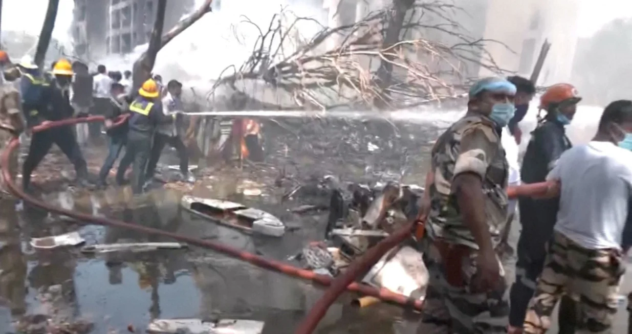Emergency personnel work at the crash site of an Air India plane in Ahmedabad, India, June 12, 2025, in this still image taken from video. ANI/Reuters TV via REUTERS THIS IMAGE HAS BEEN SUPPLIED BY A THIRD PARTY. INDIA OUT. NO COMMERCIAL OR EDITORIAL SALES IN INDIA. TPX IMAGES OF THE DAY/Ani