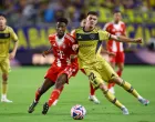 Soccer Football - FIFA Club World Cup - Group C - Bayern Munich v Boca Juniors - Hard Rock Stadium, Miami Gardens, Florida, U.S. - June 20, 2025 Bayern Munich's Kingsley Coman in action with Boca Juniors' Kevin Zenon REUTERS/Hannah Mckay