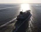 epa10116383 An aerial picture taken with a drone shows JS Ineos Innovatio (IMO Number 9744958) a LNG liquefied natural gas tanker on the Schelde River after leaving Antwerp harbour, Belgium, 11 August 2022, in direction of Rotterdam. EPA/OLIVIER HOSLET/Olivier Hoslet