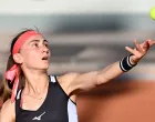 epa09241709 Aleksandra Krunic of Serbia serves during the 1st round match against Coco Gauff of the US at the French Open tennis tournament at Roland Garros in Paris, France, 01 June 2021. EPA/CAROLINE BLUMBERG
