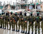 FILE PHOTO: Palestinian Hamas militants stand guard on the day of the handover of hostages held in Gaza since the deadly October 7 2023 attack, as part of a ceasefire and a hostages-prisoners swap deal between Hamas and Israel, in Rafah in the southern Gaza Strip, February 22, 2025. REUTERS/Hatem Khaled/File Photo/Hatem Khaled