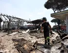 A firefighter works at the scene where a gas station exploded on the outskirts of Rome, Italy, July 4, 2025. REUTERS/Matteo Minnella  TPX IMAGES OF THE DAY/Matteo Minnella