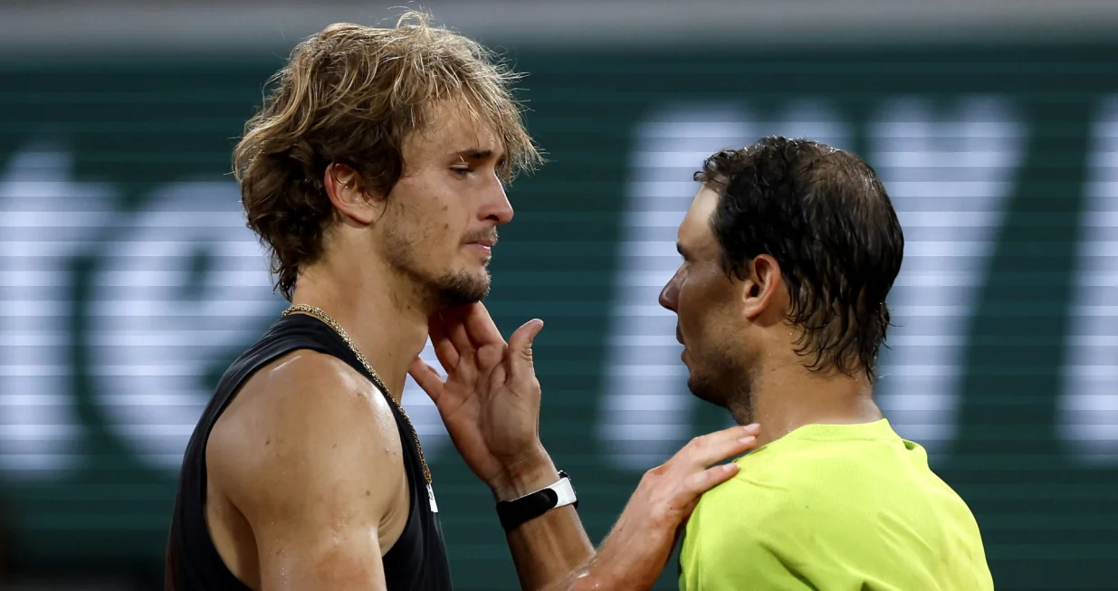 epa09994218 Alexander Zverev of Germany (L) reacts with Rafael Nadal of Spain after retiring due to an injury in the men's semi-final match during the French Open tennis tournament at Roland Garros in Paris, France, 03 June 2022. EPA/YOAN VALAT