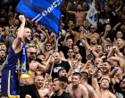 epa10159933 Miralem Halilovic of Bosnia and Herzegovina (L) celebrates with fans after winning the FIBA EuroBasket 2022 group B stage match between Bosnia and Herzegovina and Slovenia in Cologne, Germany, 04 September 2022. EPA/SASCHA STEINBACH